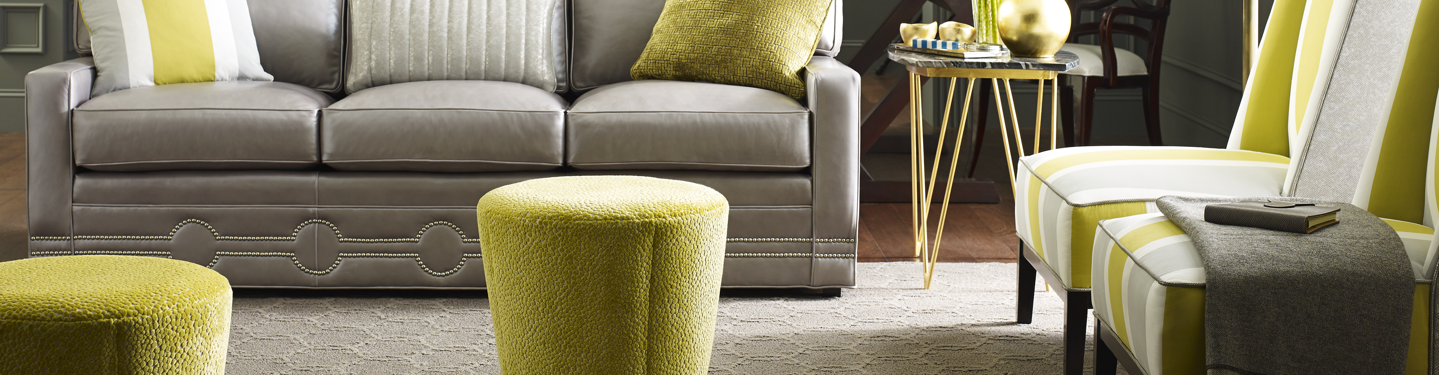 Living room with gray furniture and green accents